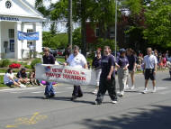 Members and their families show the banner.