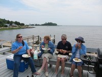 Our hostess - and some well-satisfied participants -- kick-off Summer 2010