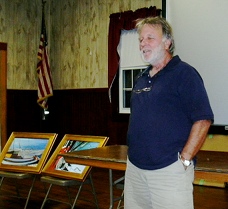 Brec with a couple of his paintings