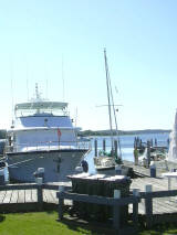 S/V Georgia towers over her dockmates, showing the NHPS burgee to the world